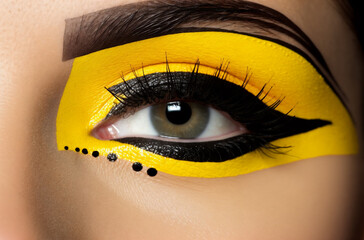 a woman with yellow and black makeup looks at the camera with her eyes closed and her eyeliner painted black, generative ai