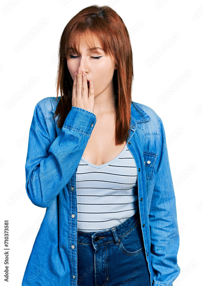 Sticker Redhead young woman wearing casual denim jacket bored yawning tired covering mouth with hand. restless and sleepiness.