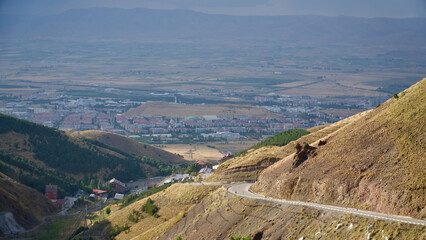 Fototapeta na wymiar Erzurum Palandoken Ski Center and Palandoken Mountain. Palandoken mountains surrounding Erzurum at the end of summer.