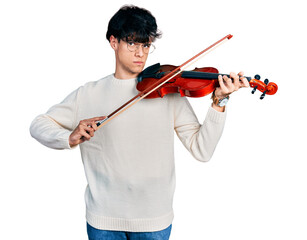 Handsome hipster young man playing violin skeptic and nervous, frowning upset because of problem. negative person. © Krakenimages.com