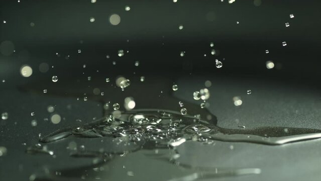 4k Slow motion oil drop on fry pan splash 