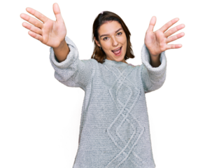 Young caucasian girl wearing casual clothes looking at the camera smiling with open arms for hug. cheerful expression embracing happiness.