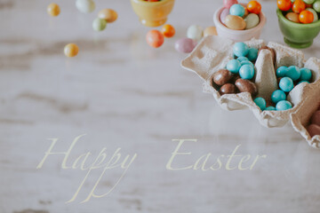 Easter background with colored sugar eggs and Happy Easter text