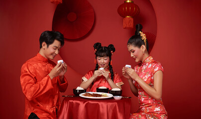 Happy Chinese new year 2024. Asian family dinner food and drinking tea for prosperity celebration...