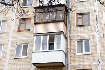 fragment of a facade of a building with balcony.