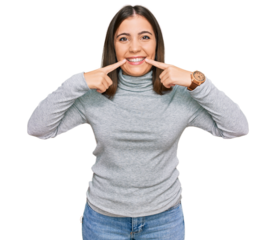 Young beautiful woman wearing casual turtleneck sweater smiling with open mouth, fingers pointing and forcing cheerful smile