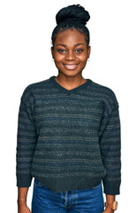 Young african american woman wearing casual clothes with a happy and cool smile on face. lucky...
