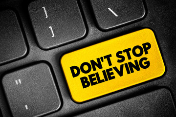 Don't Stop Believing text button on keyboard, concept background