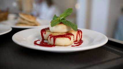 Breakfast with sausages, tomatoes, fried bacon, scrambled eggs and orange juice. Breakfast in a hotel room, close-up. Serving breakfast in your hotel room.
