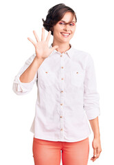 Beautiful young woman with short hair wearing elegant white shirt showing and pointing up with fingers number five while smiling confident and happy.