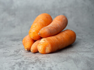 orange carrots on a gray background