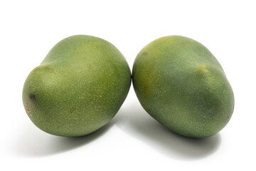 Two fresh organic green mango delicious fruit side view isolated on white background clipping path