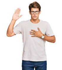 Handsome caucasian man wearing casual clothes and glasses swearing with hand on chest and open palm, making a loyalty promise oath