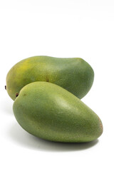 Two fresh organic green mango delicious fruit side view isolated on white background clipping path