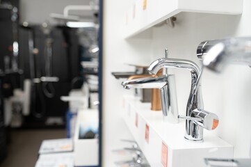 Modern kitchen and bathroom water faucets in the store