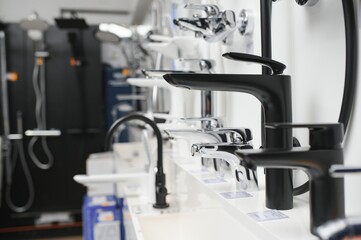 Rows of new faucets in plumbing shop