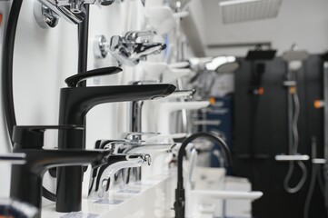 Modern kitchen and bathroom water faucets in the store