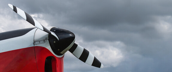 Banner Part of an Oldtimer light aircraft against a stormy sky. Copy space. Body slightly modified