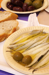 Close up Alici Marinati, Marinated fresh anchovies fish served with olive and baguette toast