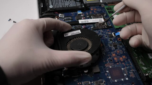 Laptop repair by a technician close-up 4k