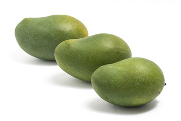 Three fresh organic green mango delicious fruit side view isolated on white background clipping path