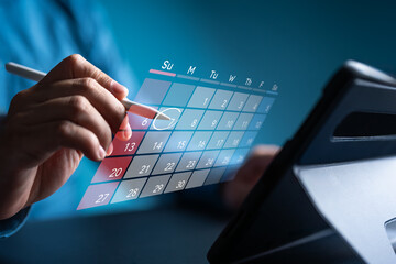 Secretary use tablet and touch virtual calendar screen. Make appointment or reminder for meeting...