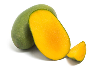 Sliced half cut and whole fresh organic green mango delicious fruit side view isolated on white background clipping path