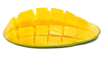 Cut into cubes fresh organic green mango delicious fruit side view isolated on white background clipping path