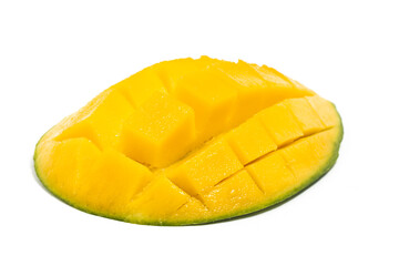 Cut into cubes fresh organic green mango delicious fruit side view isolated on white background clipping path