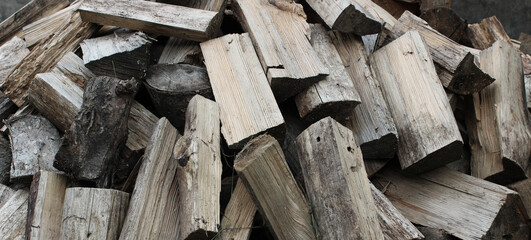 Heaped aged firewood stock photo for backgrounds 
