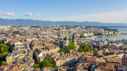Foto op Plexiglas Geneva, Switzerland. Flight over the city. Geneva Cathedral, Aerial View © nikitamaykov