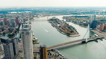 Rotterdam, Netherlands. Erasmus Bridge. Noordereiland Island. View of the city center. River Nieuwe Maas. Summer day, Rainy clouds, Aerial View
