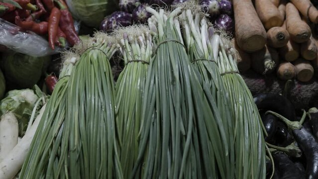 spring onions at vegetable store for sale at evening