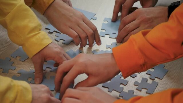 Teamwork concept. cooperation of businessmen.people put puzzle pieces together.team business.team collaboration.businessmen working together.group of people cooperate.business solution.success in team