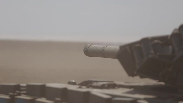 Ukrainian army tank shoots on a battlefield
