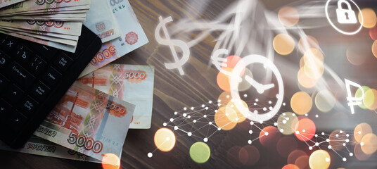 Russian rubles are on the table next to the computer, Notepad in the office or Bank. Savings and...
