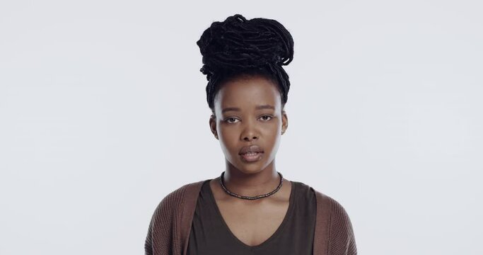 Frustrated, rolling eyes and face of black woman in studio for anger, bad attitude and rejection. Annoyed, bored and portrait of person with eye roll, gesture and emoji reaction on white background