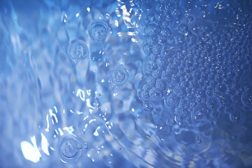 Blue water texture. Bubbles and bubbling water.