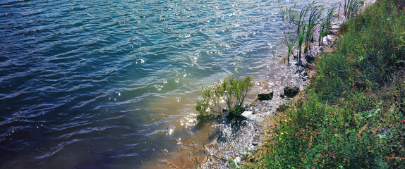 Water surface. The texture of the water. Waves on the lake in windy weather.