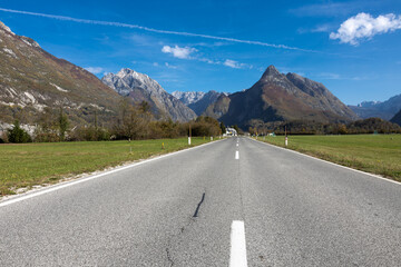 Fototapeta premium Infinity Vanishing Point Road into Mountains Copy Space Background