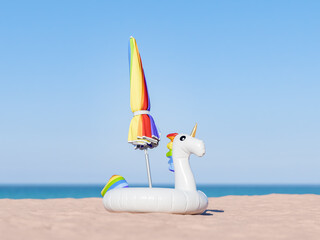 vibrant rainbow-colored beach umbrella and a whimsical unicorn inflatable float on a sandy beach against a clear blue sky, concept of summer fun.