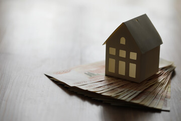 Russian money and a house. Ruble mortgage. house symbol with money, russian rubles on the calculator