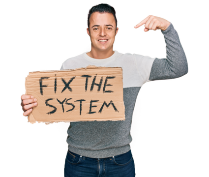 Handsome young man holding fix the system banner cardboard pointing finger to one self smiling happy and proud