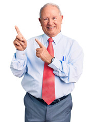 Senior handsome grey-haired man wearing elegant tie and shirt smiling and looking at the camera pointing with two hands and fingers to the side.