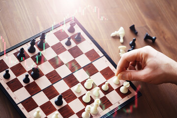 Black and White chess with player, Businessman and Businesswoman shaking hands after end game of...