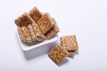 Indian traditional sweet called tilgul wadi, or sesame and jaggery sweet 