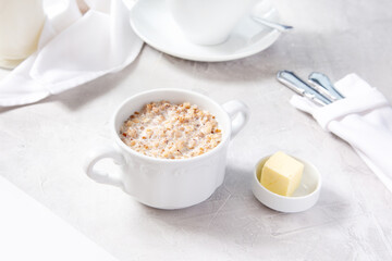Buckwheat porridge with butter, breakfast in a cafe