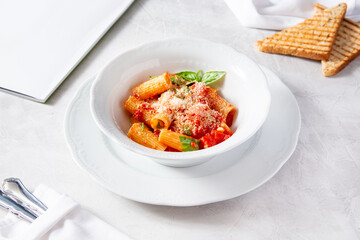 Rigatoni pasta with tomato sauce and parmesan cheese