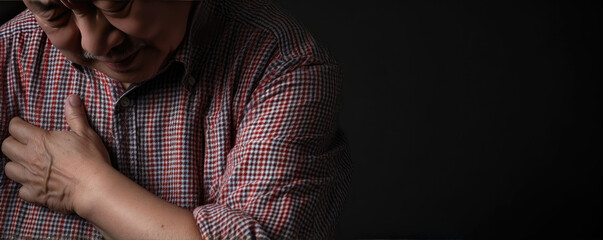 Asian elder man has a pain in shoulder.