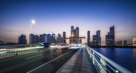 Busy City Bridge at Twilight with Dynamic Light Trails